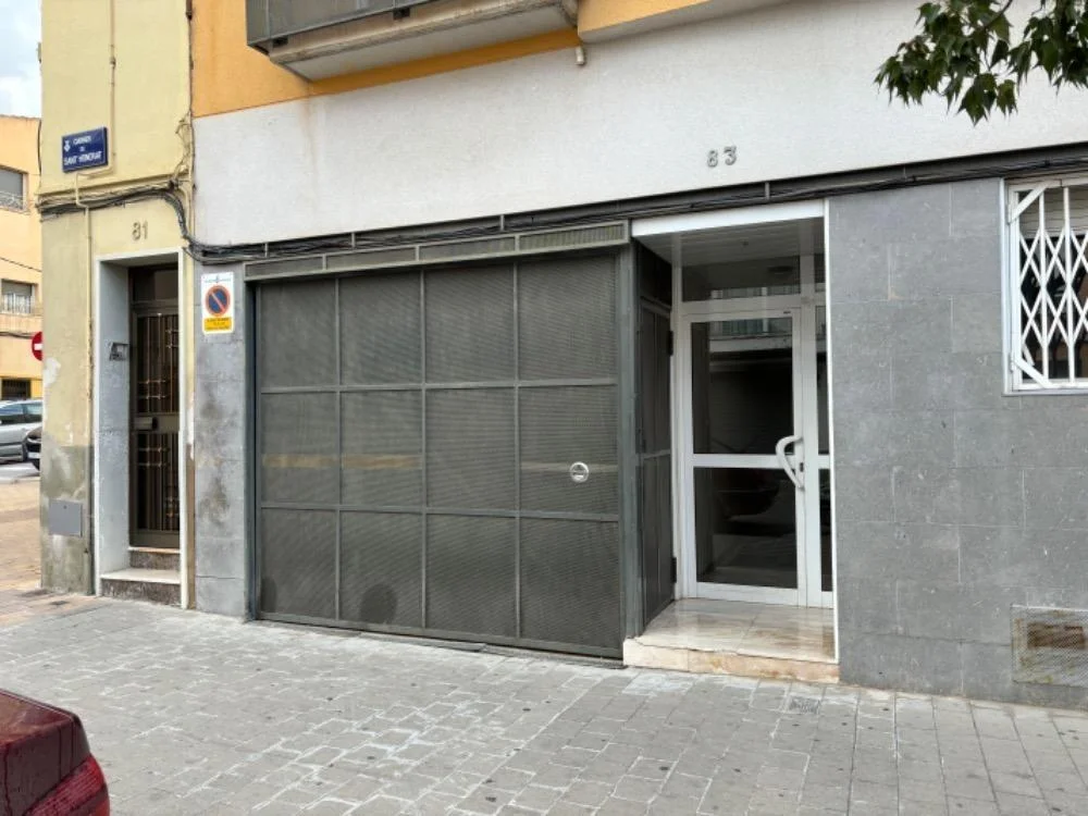 Three-space parking lot with storage
