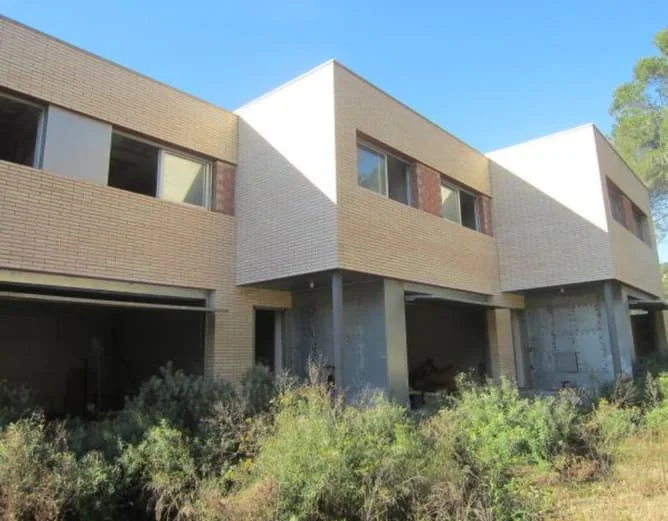 Residential development with four stalled homes