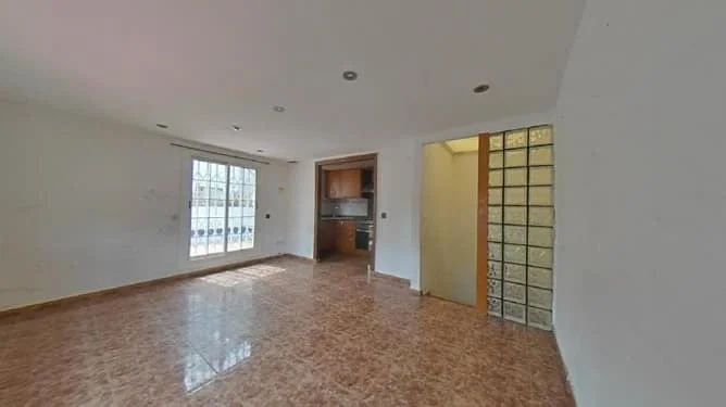 Occupied Badalona townhouse, four-bedroom investment