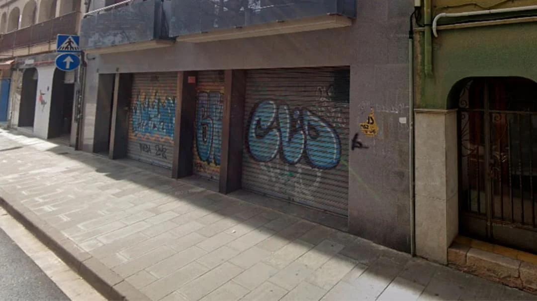 Street-front commercial unit with illegal occupants