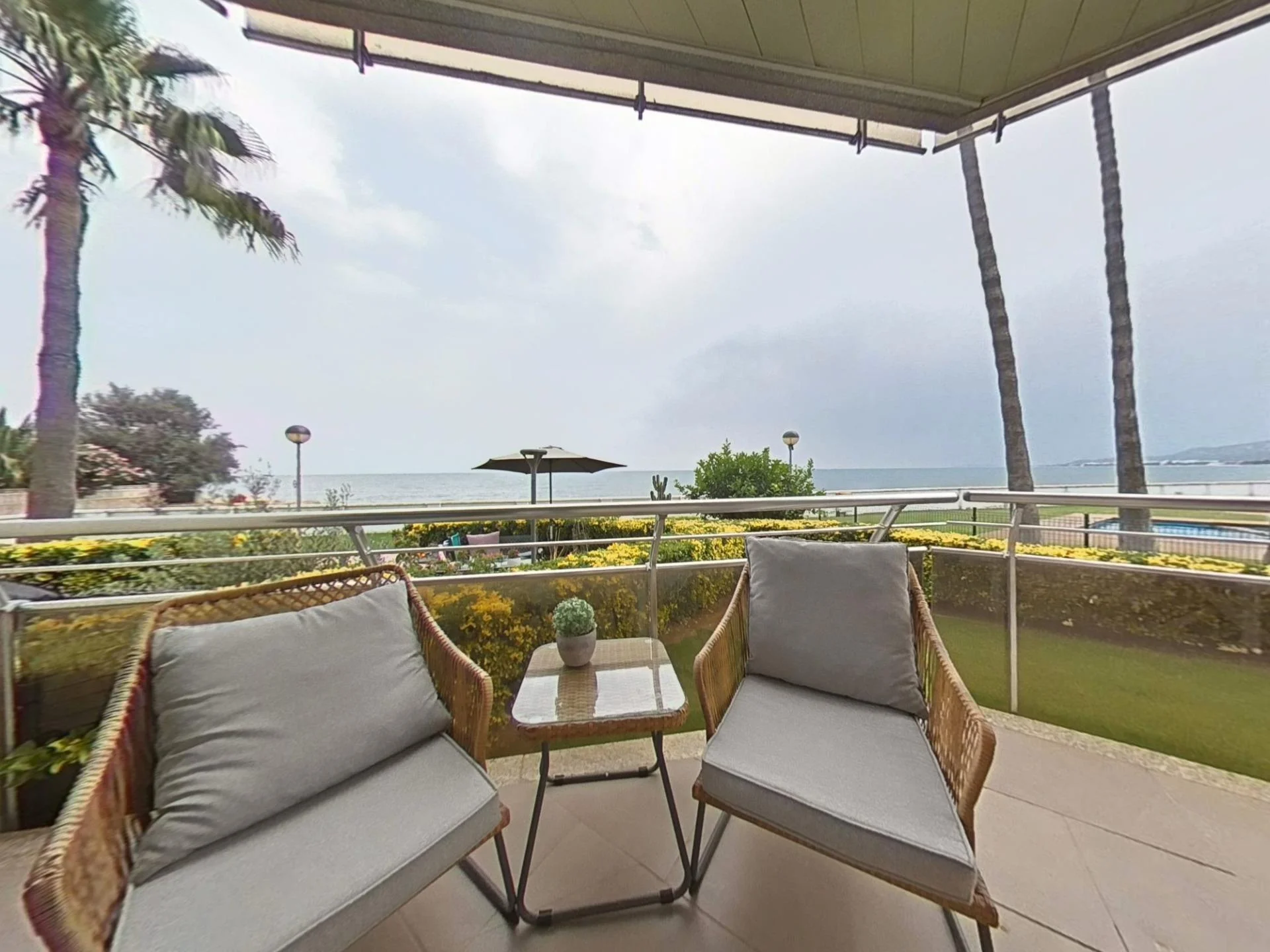 South-facing coastal flat with pool