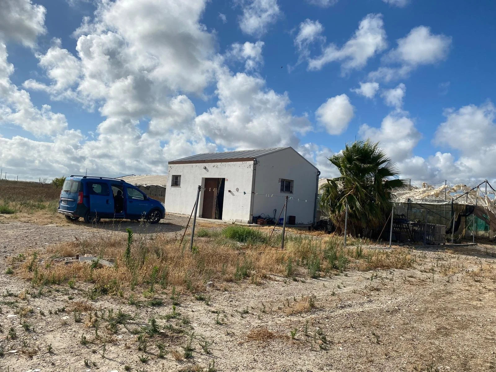 Rural Rota plot with greenhouse warehouse
