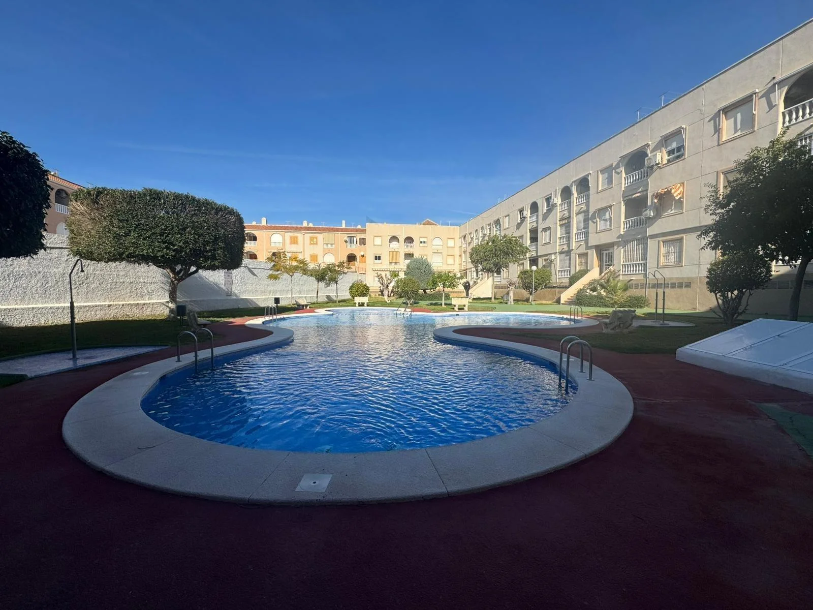 Seaside apartment with communal pool