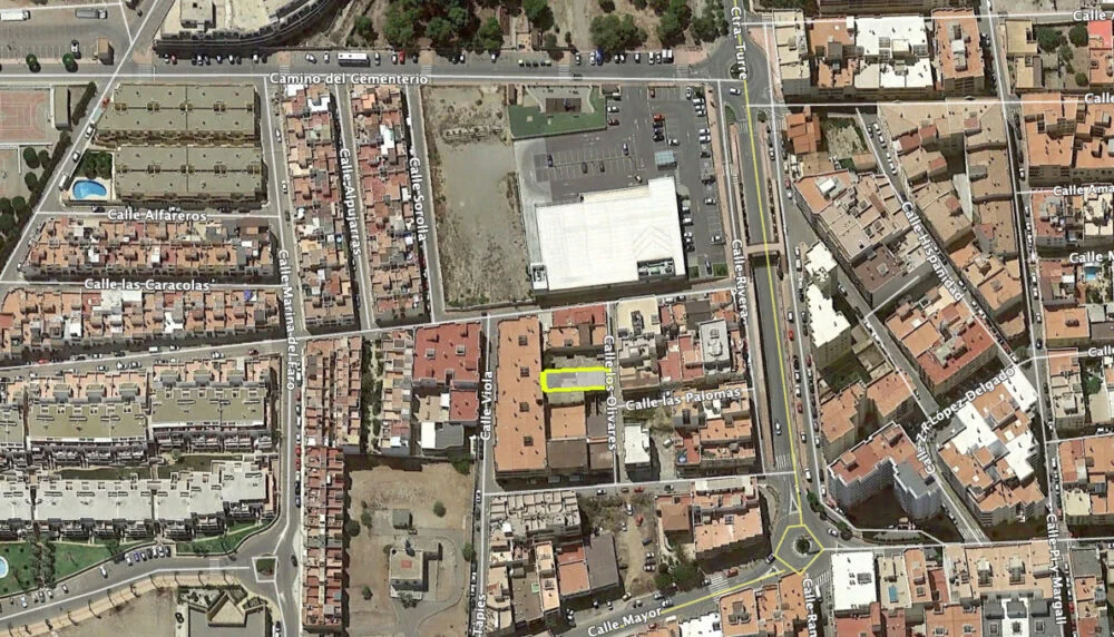 Urban plot near sea with warehouse