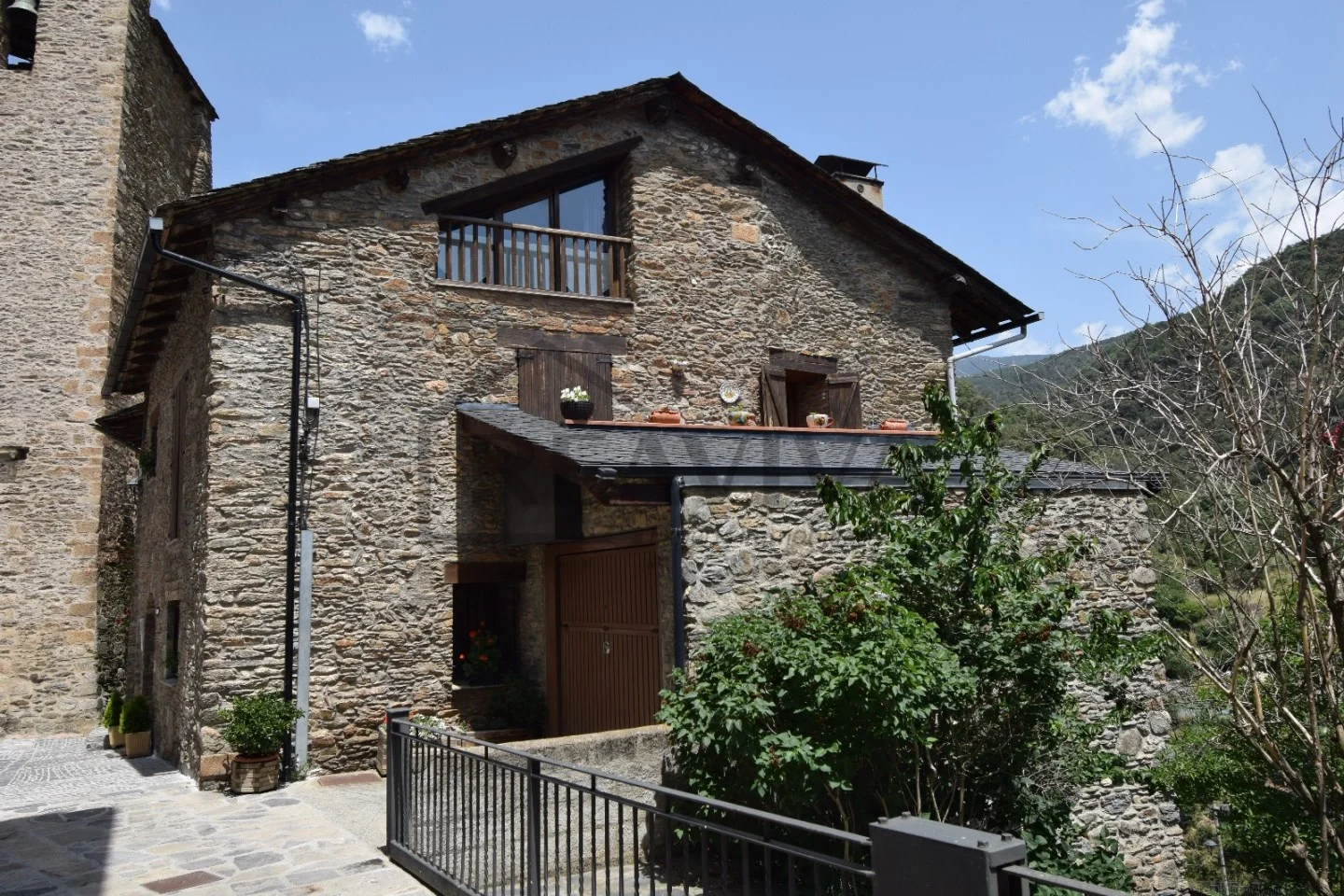 Traditional stone house with mountain views