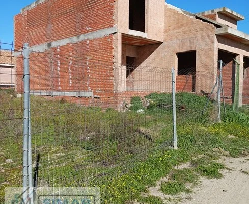 Bank-owned stalled building in Camarena