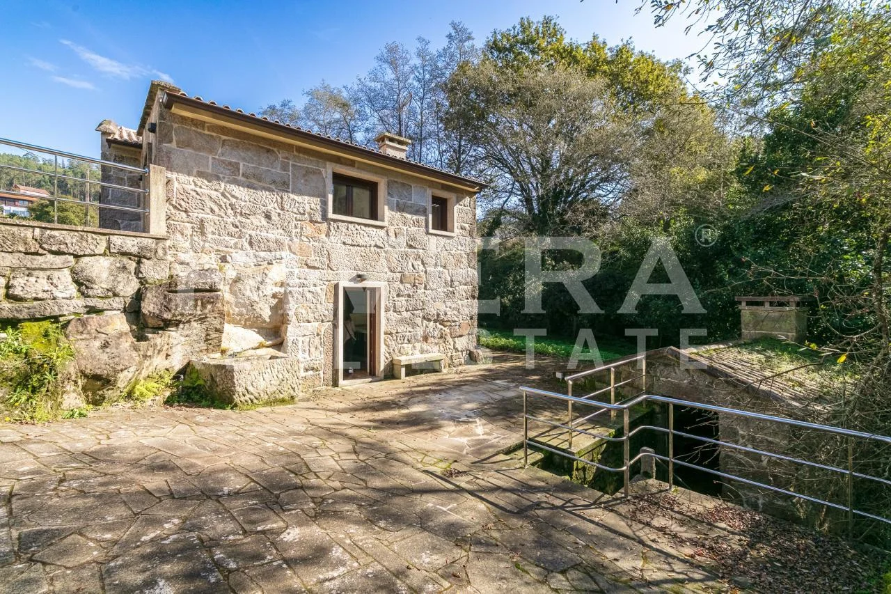 Rehabilitated rustic house by river