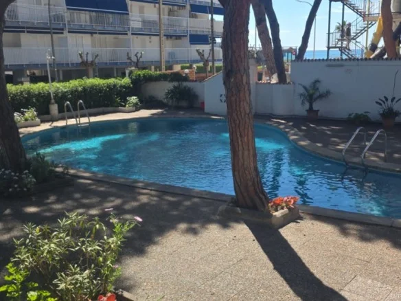 Coastal apartment with communal pool