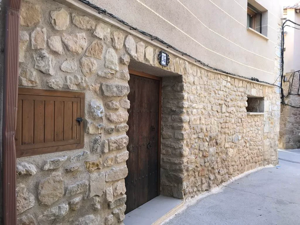 Restored village house with original stone
