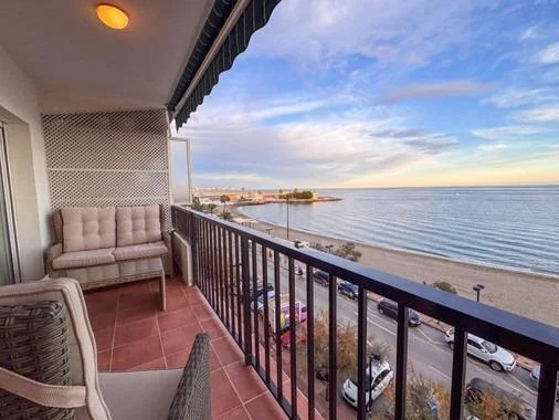 Seafront apartment with communal pool