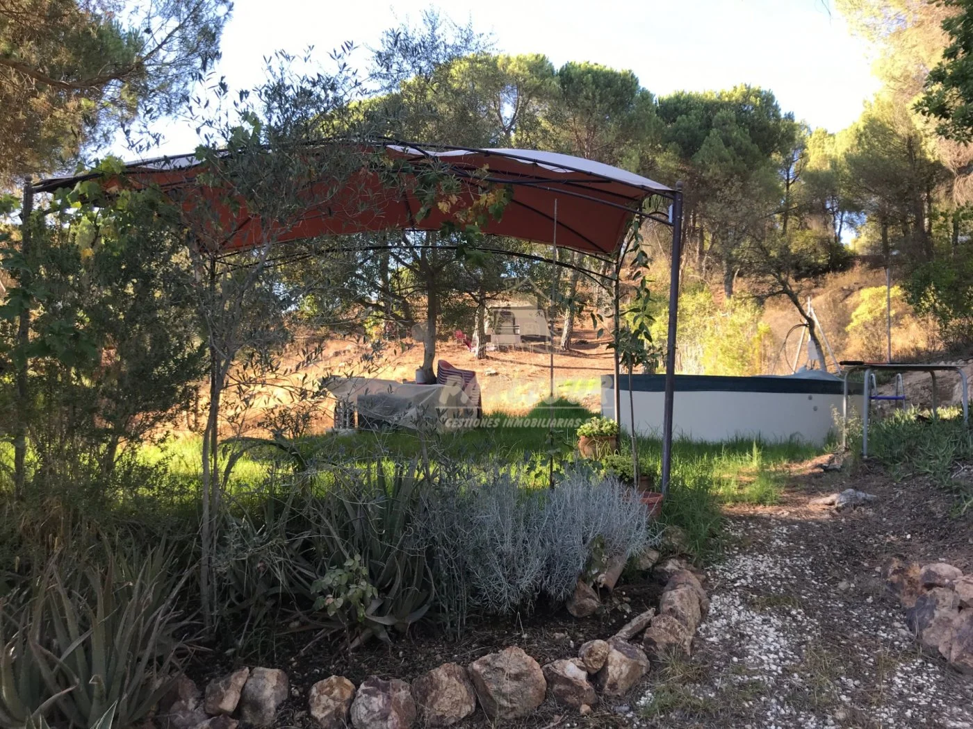 Fenced Trassierra plot with pool
