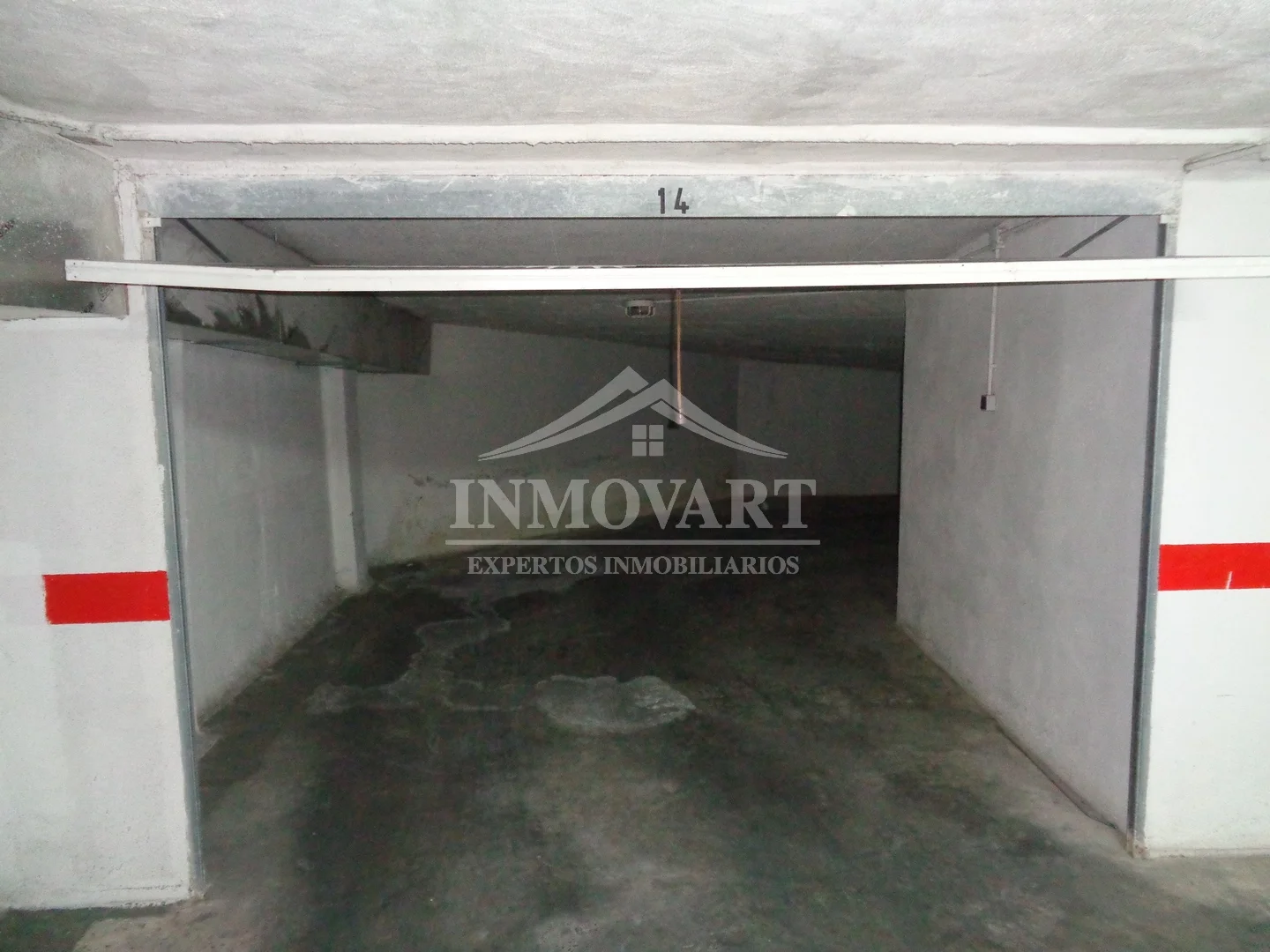Enclosed central garage in basement