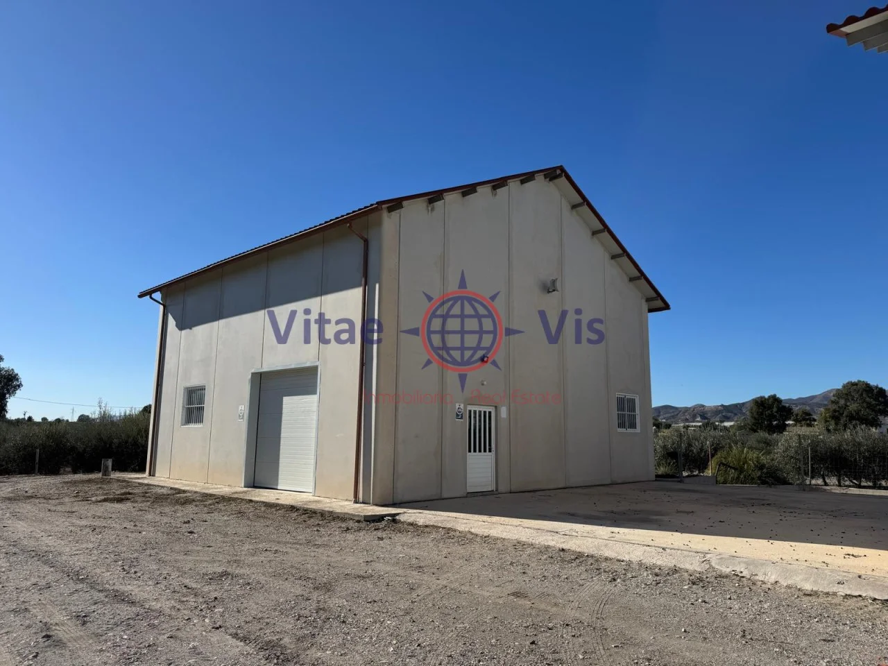 Large plot home with outbuildings