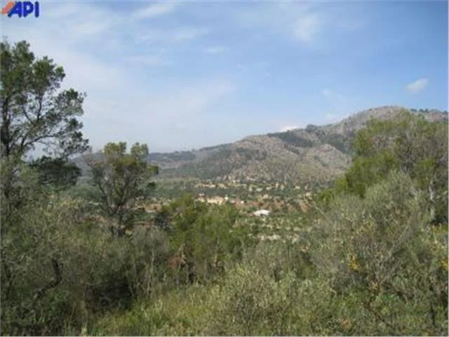 Mountain land with rural cottage