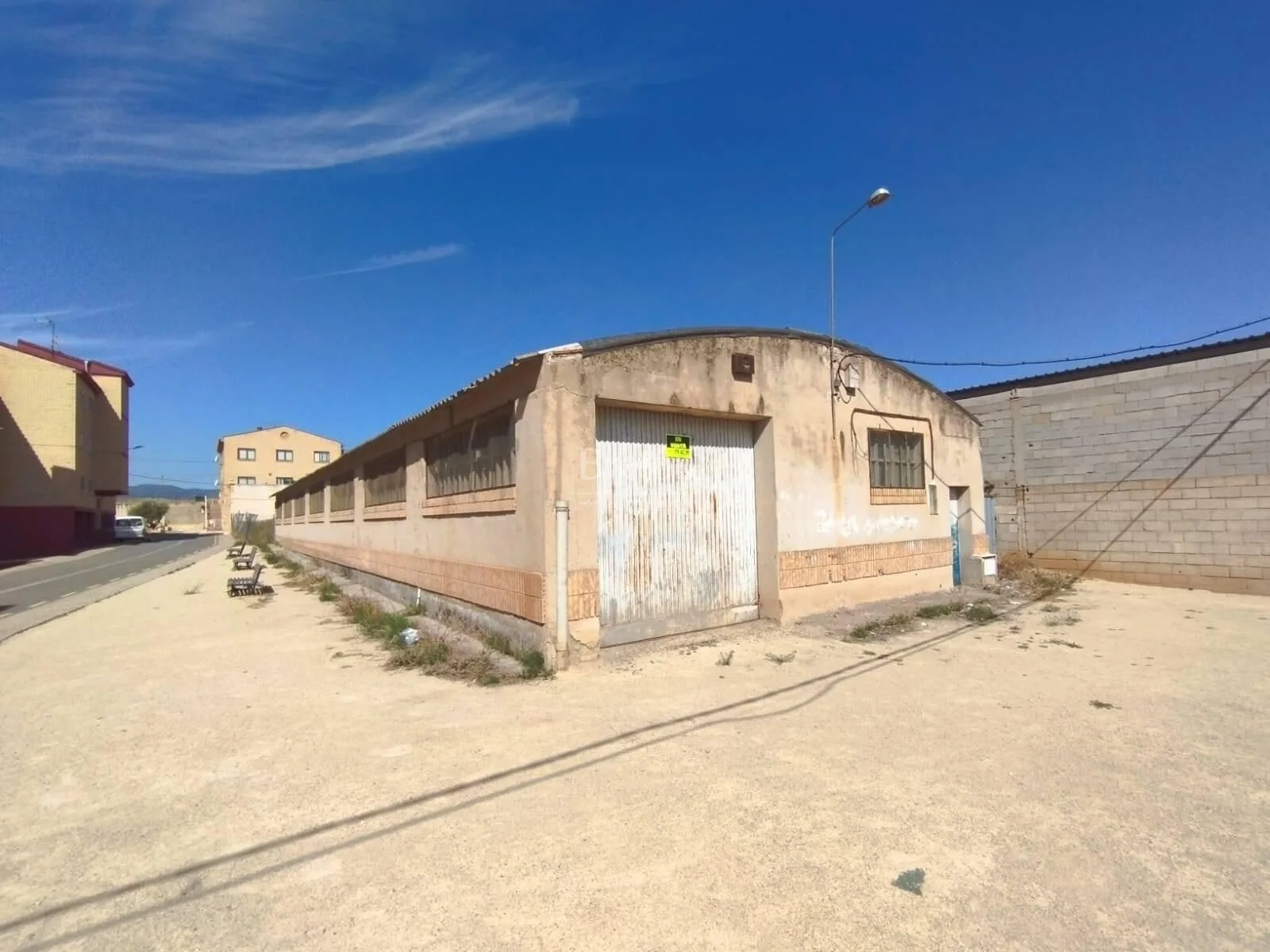 Urban developable plot with warehouse