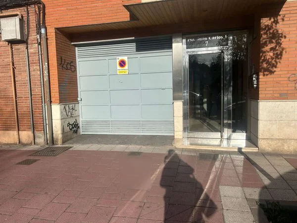 Two enclosed street-level garage spaces