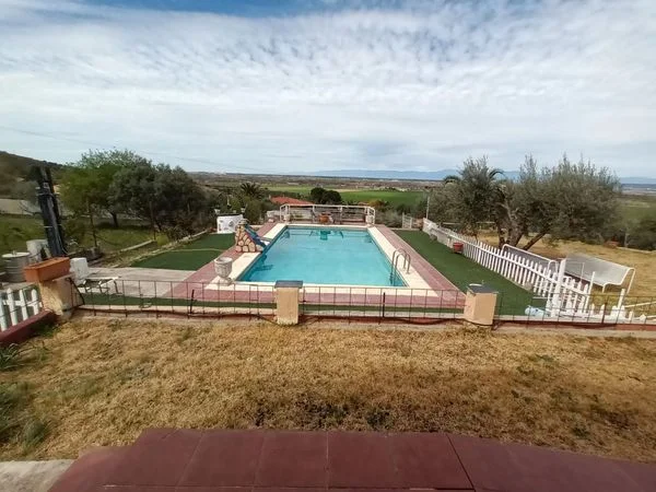 Rustic plot with house and pool