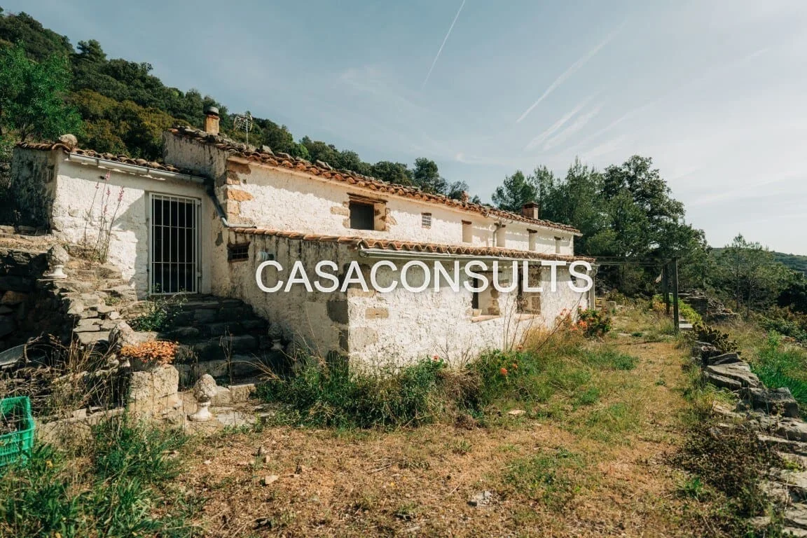 Rural masia with mountain views